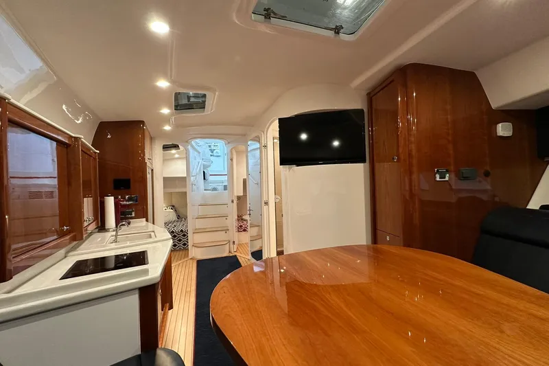 Slide: The Image of Luxurious interior of 2020 Intrepid 475 Sport Yacht with wood finishes and modern amenities. - 8