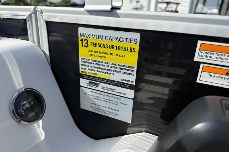 Slide: The Image of 2024 Hurricane FunDeck 2260 RE OB capacity label, maximum 13 persons or 1815 lbs. - 19