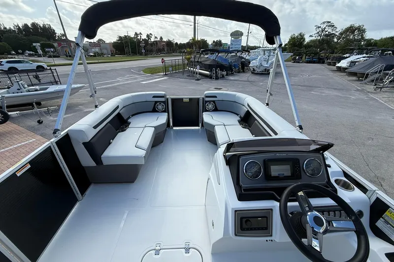 Slide: The Image of 2024 Hurricane FunDeck 2260 RE OB boat interior with seating and steering console. - 22
