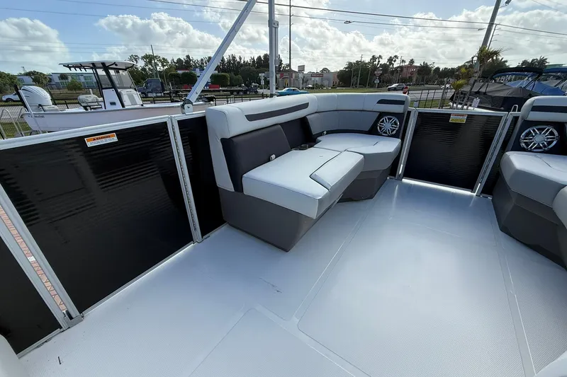 Slide: The Image of 2024 Hurricane FunDeck 2260 RE OB boat interior with spacious seating and modern design. - 24