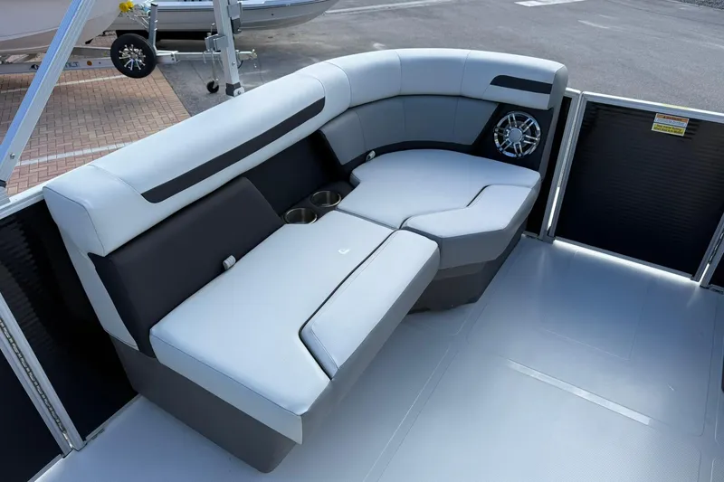 Slide: The Image of 2024 Hurricane FunDeck 2260 RE OB boat interior with cushioned seating and speaker system. - 26