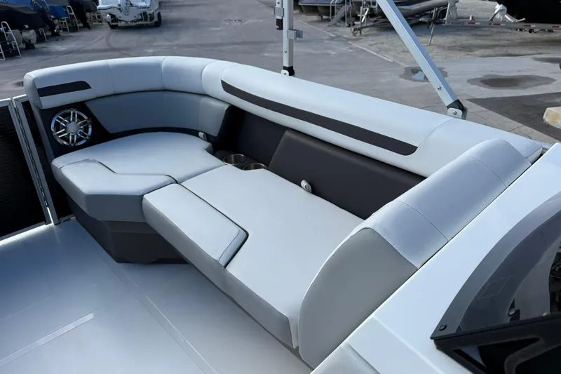 Slide: The Image of 2024 Hurricane FunDeck 2260 RE OB boat interior with sleek seating and cup holders. - 27