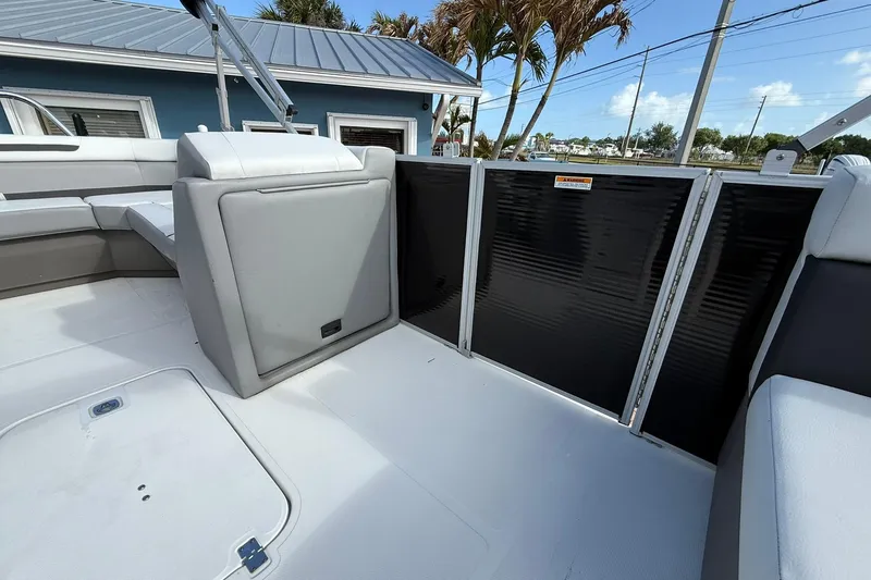 Slide: The Image of 2024 Hurricane FunDeck 2260 RE OB interior with seating and storage, showcasing modern design. - 28