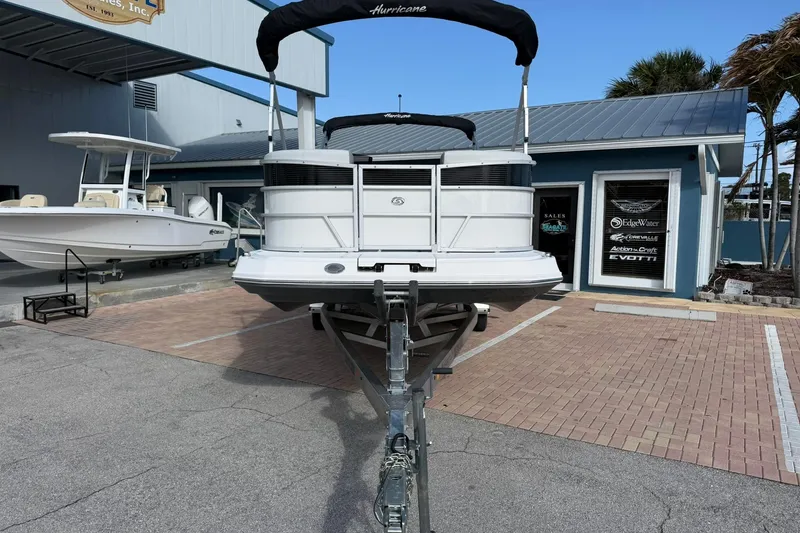 Slide: The Image of 2024 Hurricane FunDeck 2260 RE OB boat on trailer at dealership. - 3