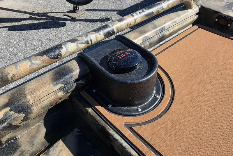Slide: The Image of Camouflage-patterned Excel 1854 F4 boat interior with a black GPS device, 2026 model. - 14