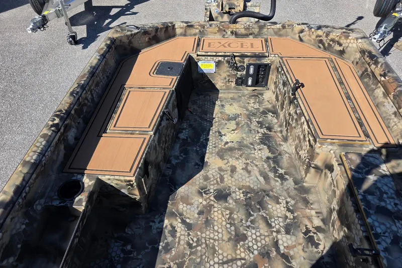 Slide: The Image of Interior of 2026 Excel 1854 F4 boat with camouflage design and storage compartments. - 15