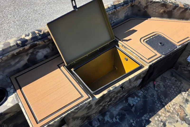 Slide: The Image of Open storage compartment in 2026 Excel 1854 F4 boat with camouflage design. - 16