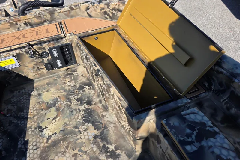 Slide: The Image of Camouflage interior of 2026 Excel 1854 F4 boat with open storage compartment. - 17