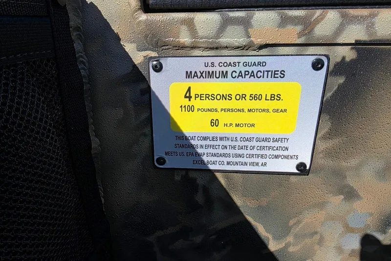 Slide: The Image of U.S. Coast Guard capacity label on Excel 1854 F4 boat, 2026 model. - 18