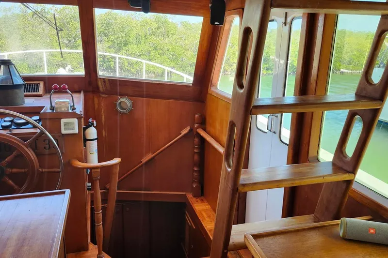 Slide: The Image of Interior of 1979 Marine Trader 50 Trawler with wooden helm and ladder. - 13