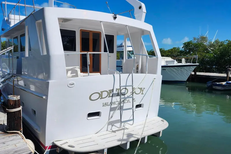 Slide: The Image of 1979 Marine Trader 50 Trawler docked in Islamorada, Florida, with clear blue skies. - 2