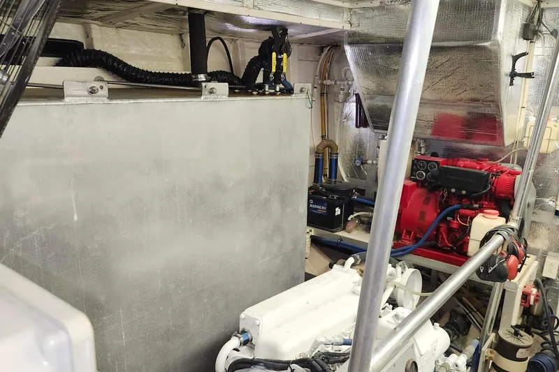 Slide: The Image of Engine room of a 1979 Marine Trader 50 Trawler with visible machinery and equipment. - 29