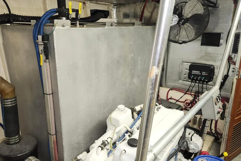 Slide: The Image of Engine room of a 1979 Marine Trader 50 Trawler with visible machinery and wiring. - 30