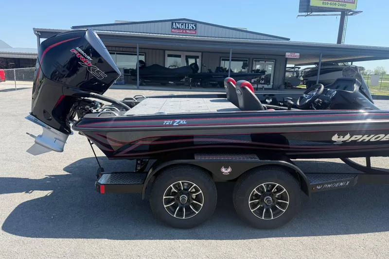 Slide: The Image of 2026 Phoenix 721 ZXL boat with powerful Mercury engine at dealership. - 5
