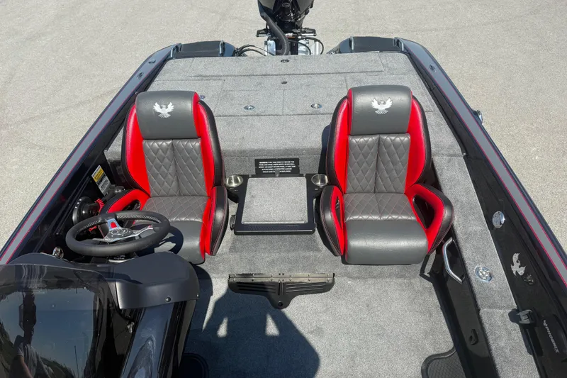 Slide: The Image of 2026 Phoenix 721 ZXL boat interior with red and gray seats, steering wheel, and carpeted flooring. - 9