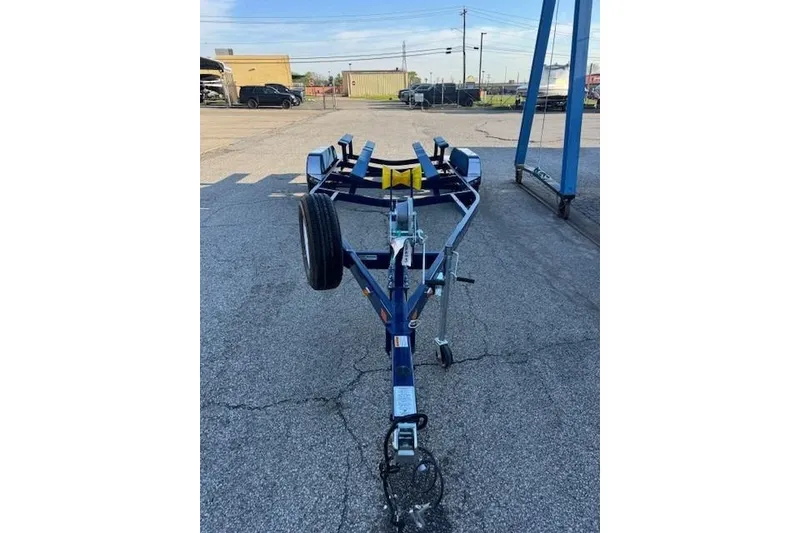 Slide: The Image of Trailer for 2024 Crownline 240 SS boat in parking lot. - 5