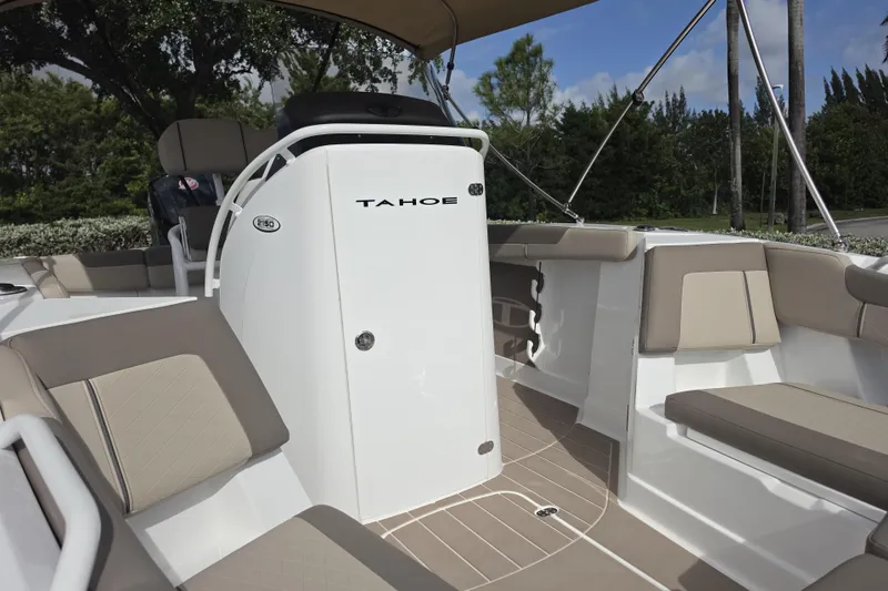 Slide: The Image of 2026 Tahoe 2150 CC boat interior with beige seating and sleek design. - 10