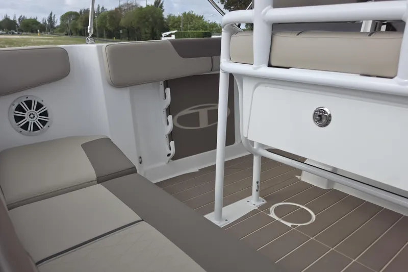Slide: The Image of Interior of 2026 Tahoe 2150 CC boat with beige seating and storage compartment. - 20