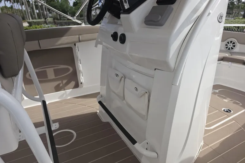 Slide: The Image of Interior view of 2026 Tahoe 2150 CC boat, featuring helm and seating area. - 5