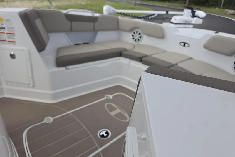 Slide: The Image of Interior view of 2026 Tahoe 2150 CC boat with cushioned seating and modern design. - 7