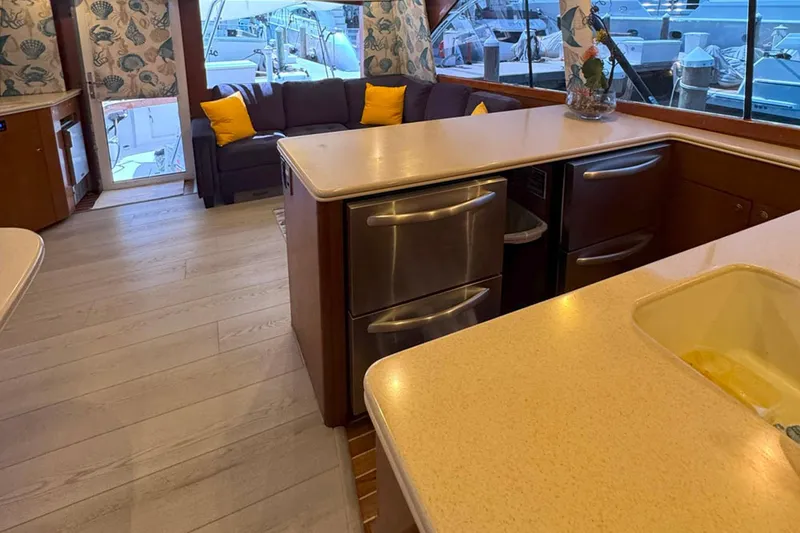 Slide: The Image of Luxurious interior of 1997 Ocean Yachts 48 Super Sport with modern kitchen and cozy seating. - 11