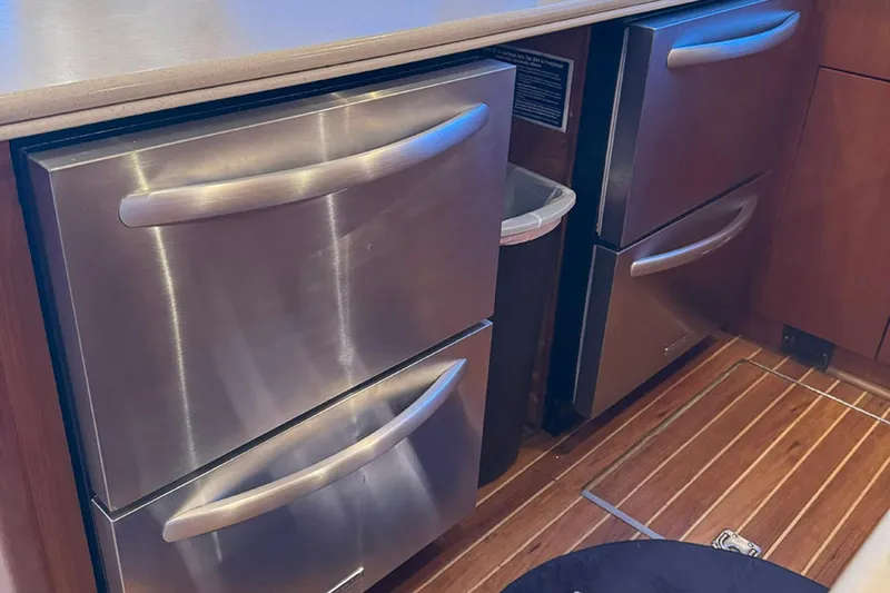 Slide: The Image of Stainless steel kitchen drawers on 1997 Ocean Yachts 48 Super Sport boat. - 12