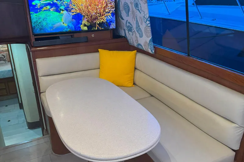 Slide: The Image of Interior of 1997 Ocean Yachts 48 Super Sport with cozy seating and vibrant decor. - 15