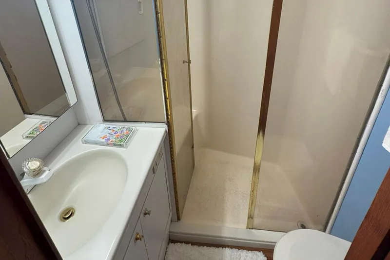 Slide: The Image of Bathroom interior of 1997 Ocean Yachts 48 Super Sport with shower and sink. - 18