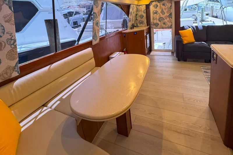 Slide: The Image of Luxurious interior of a 1997 Ocean Yachts 48 Super Sport with elegant seating and decor. - 3