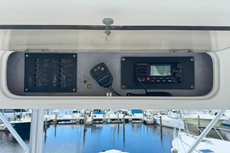 Slide: The Image of Control panel and radio on a 1997 Ocean Yachts 48 Super Sport boat. - 35