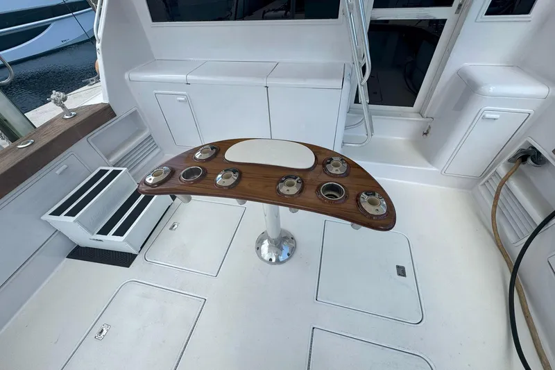Slide: The Image of 1997 Ocean Yachts 48 Super Sport cockpit with fishing rod holders and storage compartments. - 40