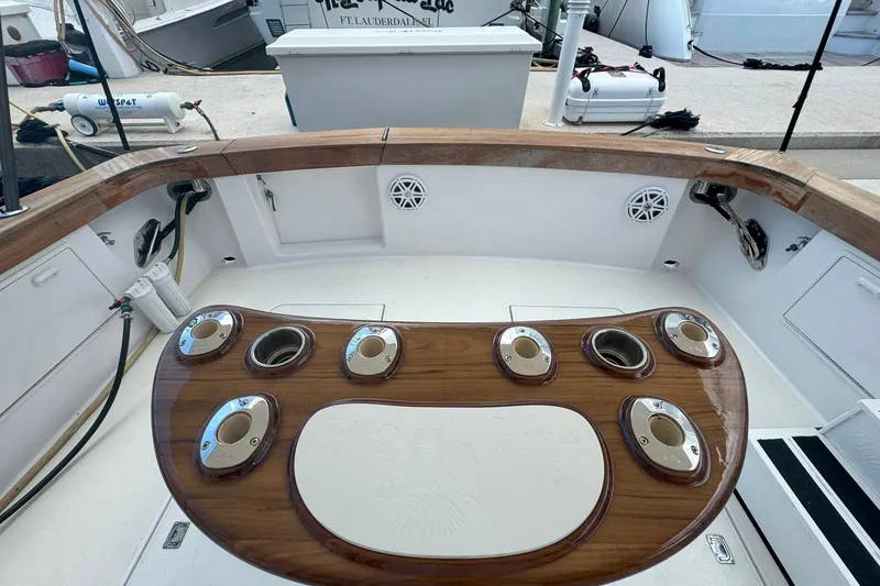Slide: The Image of 1997 Ocean Yachts 48 Super Sport cockpit with wooden rod holders and clean deck. - 42
