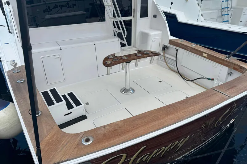 Slide: The Image of 1997 Ocean Yachts 48 Super Sport boat deck with fishing rod holders and storage. - 43