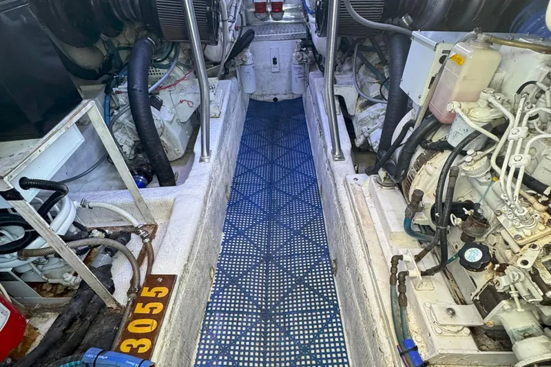 Slide: The Image of Engine room of a 1997 Ocean Yachts 48 Super Sport, showcasing mechanical components. - 51