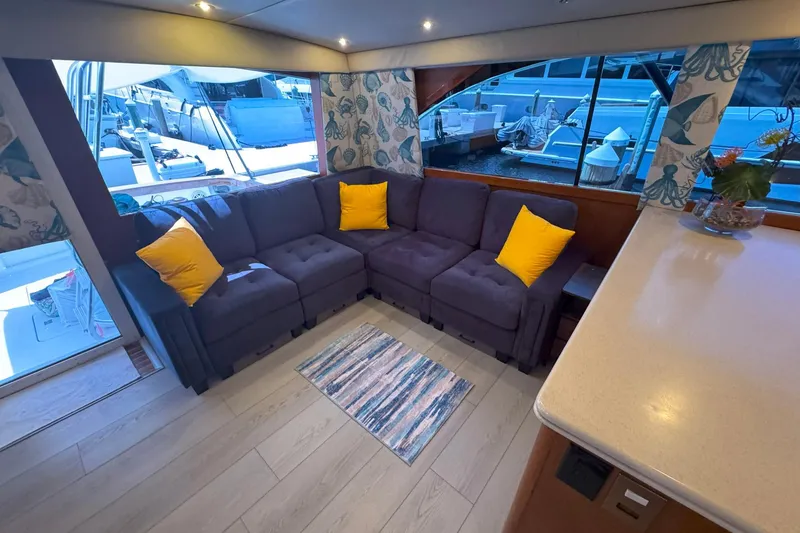 Slide: The Image of Luxurious interior of 1997 Ocean Yachts 48 Super Sport with cozy seating and vibrant decor. - 9
