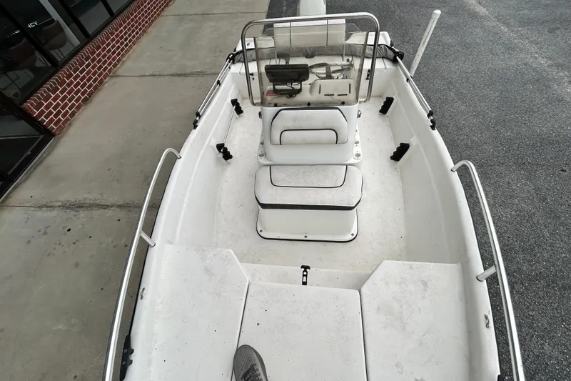 Slide: The Image of 2019 Cape Craft 160cc boat interior with seating and steering console. - 10