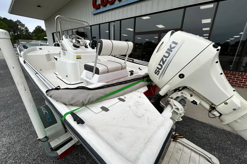 Slide: The Image of 2019 Cape Craft 160cc boat with Suzuki outboard motor, parked outside a store. - 11