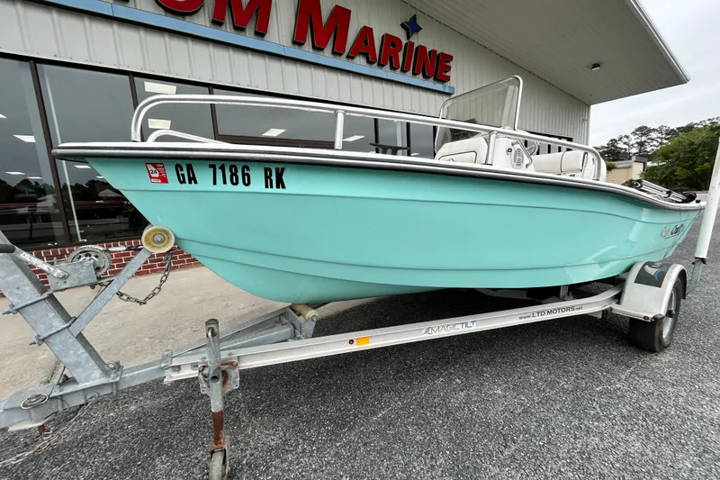 Slide: The Image of 2019 Cape Craft 160cc boat on trailer outside marine dealership. - 2