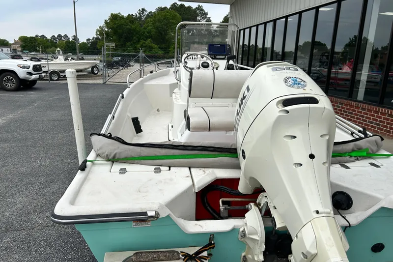 Slide: The Image of 2019 Cape Craft 160cc boat with Suzuki outboard motor, parked outside dealership. - 3