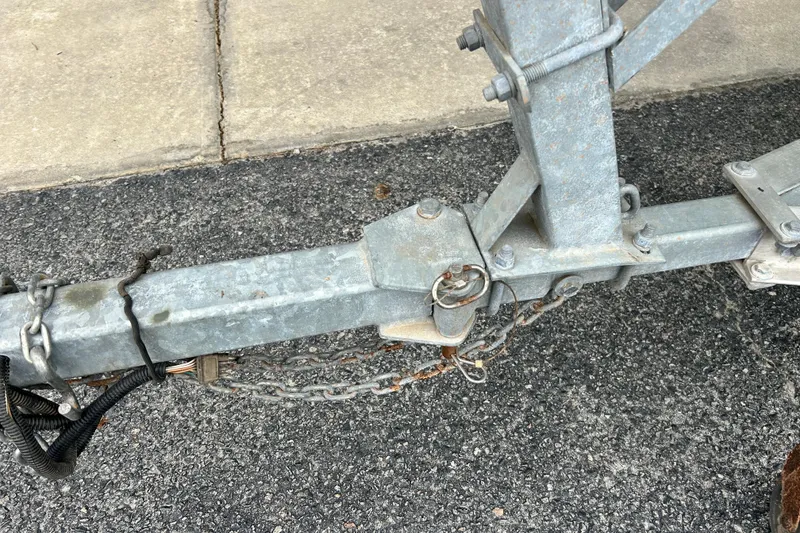 Slide: The Image of Trailer hitch of a 2019 Cape Craft 160cc on asphalt pavement. - 5