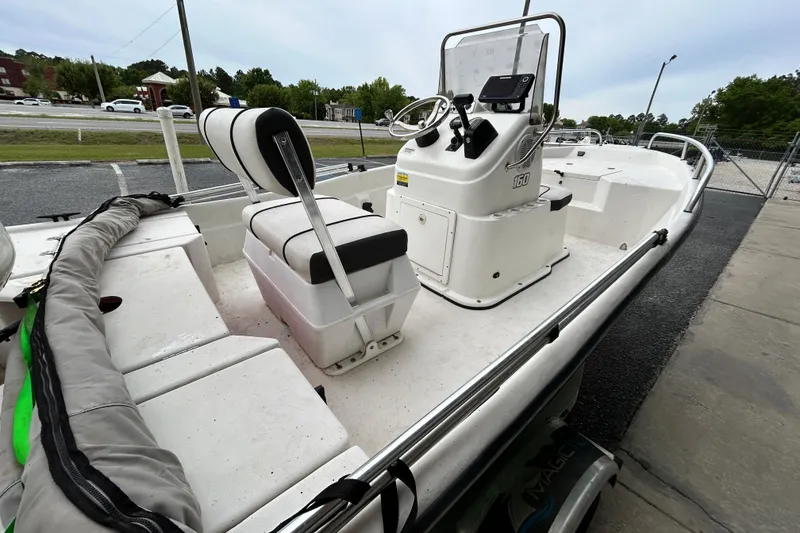 Slide: The Image of 2019 Cape Craft 160cc boat with center console and seating, parked outdoors. - 6