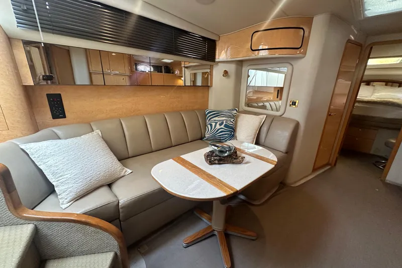 Slide: The Image of Luxurious interior of 1998 Sea Ray 450 Sundancer yacht with elegant seating and decor. - 2