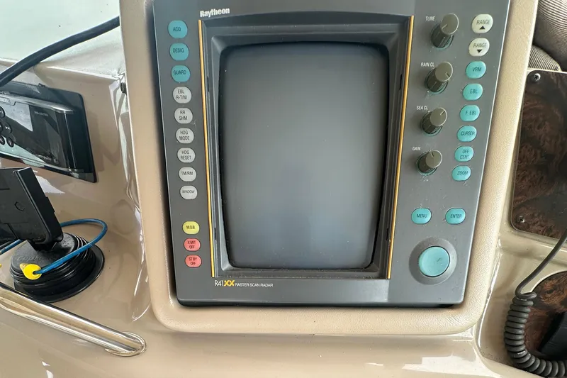 Slide: The Image of Raytheon radar display on 1998 Sea Ray 450 Sundancer boat dashboard. - 21
