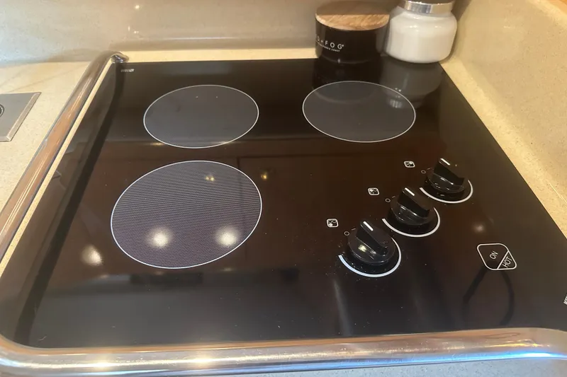 Slide: The Image of Electric stovetop in 1998 Sea Ray 450 Sundancer yacht kitchen. - 7