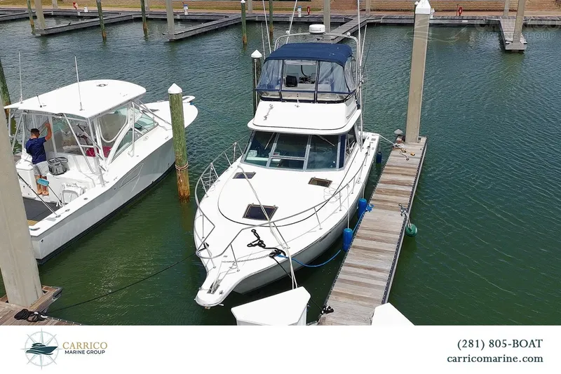 The Image of 1989 Tiara Yachts 3100 Flybridge docked at marina. - 0