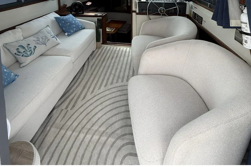 Slide: The Image of Interior of 1989 Tiara Yachts 3100 Flybridge with plush seating and nautical decor. - 14