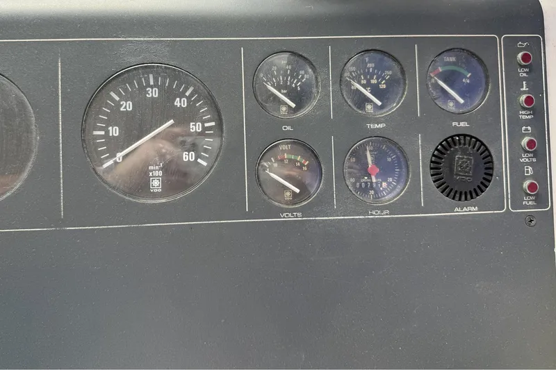 Slide: The Image of Dashboard of a 1989 Tiara Yachts 3100 Flybridge with gauges and indicators. - 39