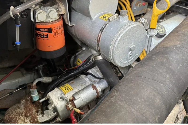 Slide: The Image of Engine components of a 1989 Tiara Yachts 3100 Flybridge, featuring a Fram oil filter. - 40