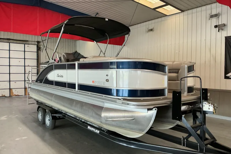 Slide: The Image of 2021 Barletta L23UC pontoon boat on trailer in indoor storage facility. - 14