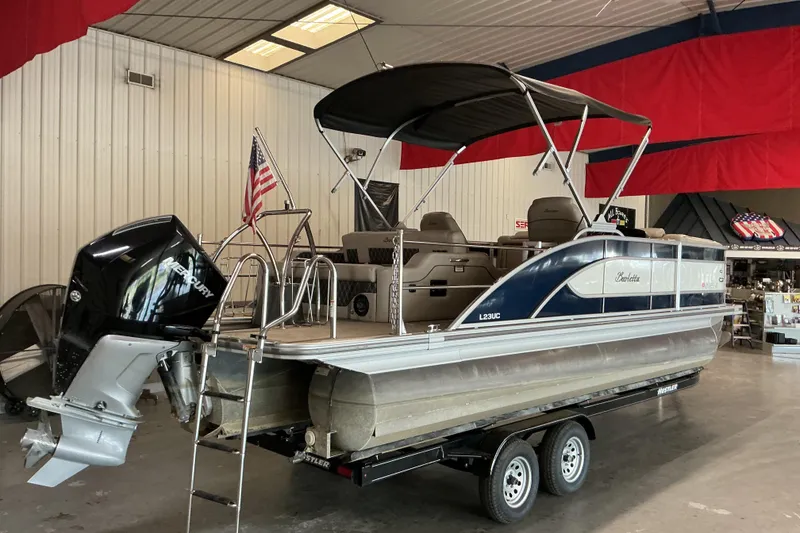 Slide: The Image of 2021 Barletta L23UC pontoon boat with Mercury engine in showroom. - 17